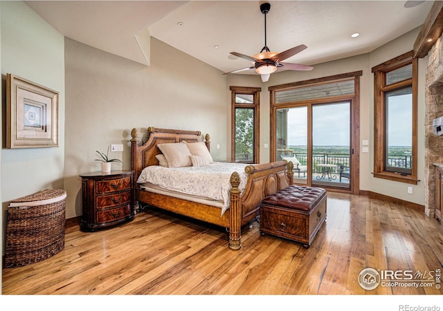 bedroom with access to exterior, light hardwood / wood-style flooring, and ceiling fan