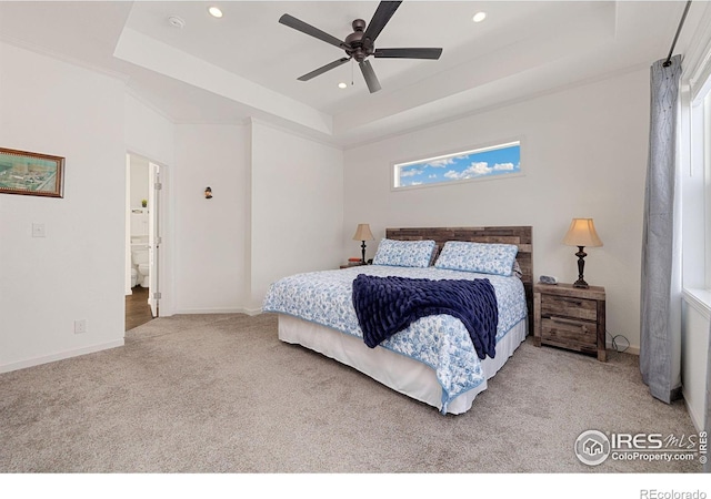 carpeted bedroom with baseboards, a raised ceiling, and recessed lighting