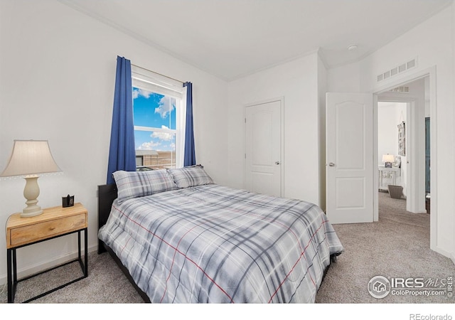 bedroom featuring carpet and visible vents