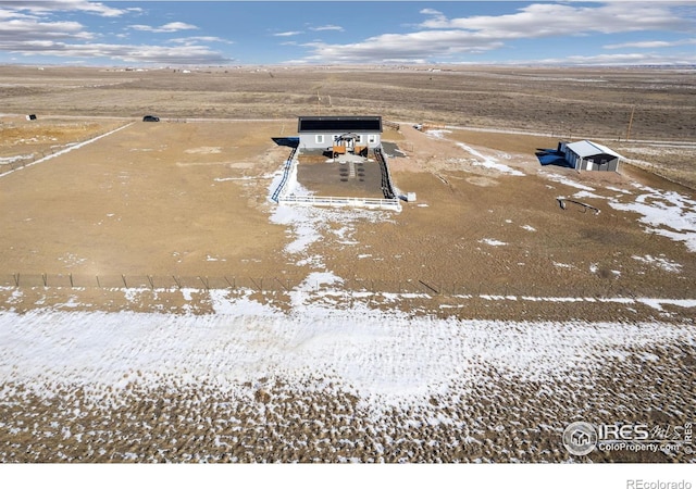 snowy aerial view with a rural view