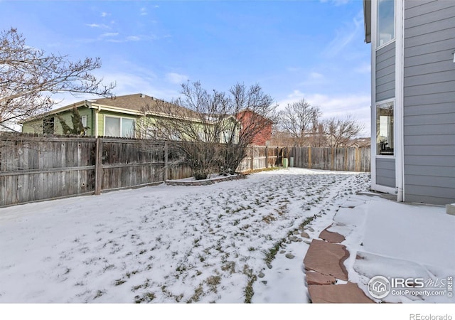 view of yard covered in snow