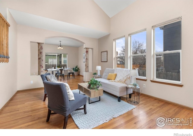 living room featuring light hardwood / wood-style floors and lofted ceiling