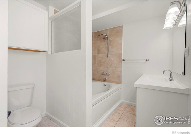 full bathroom featuring tile patterned floors, vanity, toilet, and tiled shower / bath