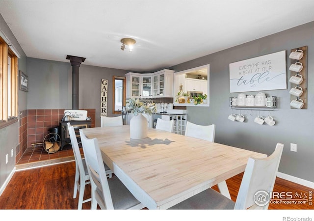 dining area featuring dark wood-type flooring