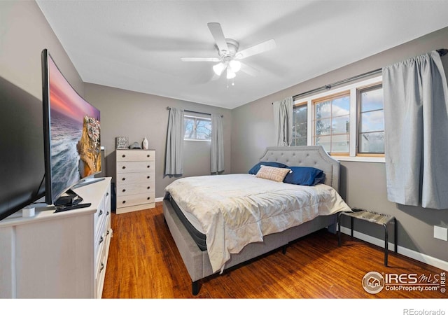 bedroom featuring hardwood / wood-style flooring and ceiling fan