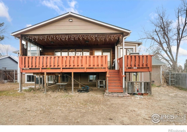 rear view of house with a wooden deck