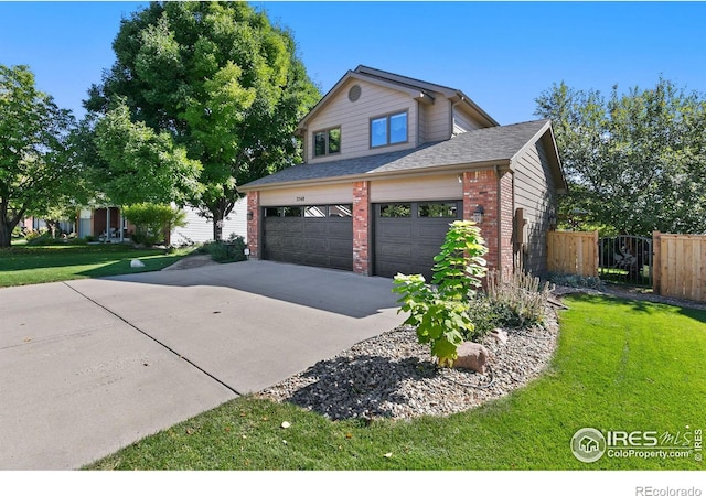 view of side of home with a lawn and a garage