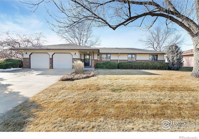 single story home with a front lawn and a garage