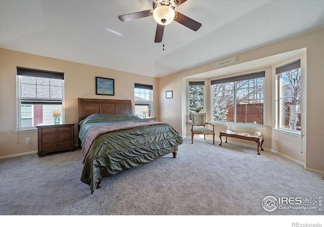 bedroom featuring ceiling fan and light carpet