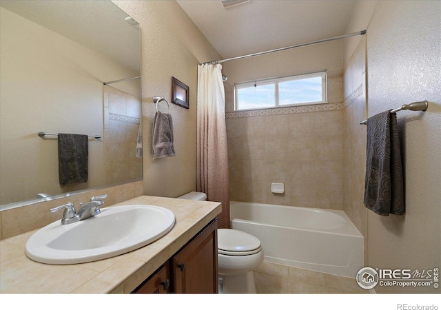 full bathroom with vanity, shower / bath combo, and toilet