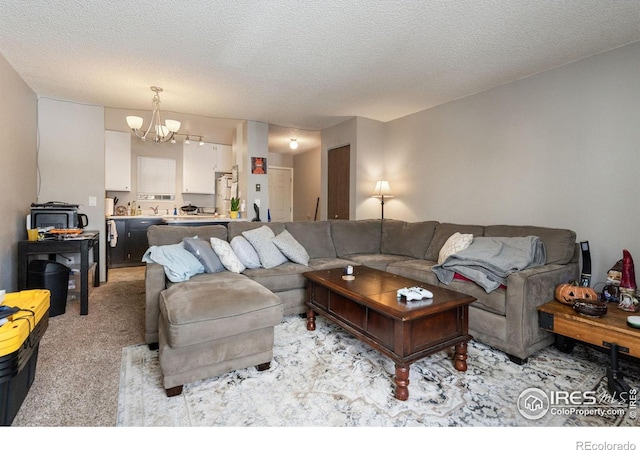 carpeted living room featuring a chandelier and a textured ceiling