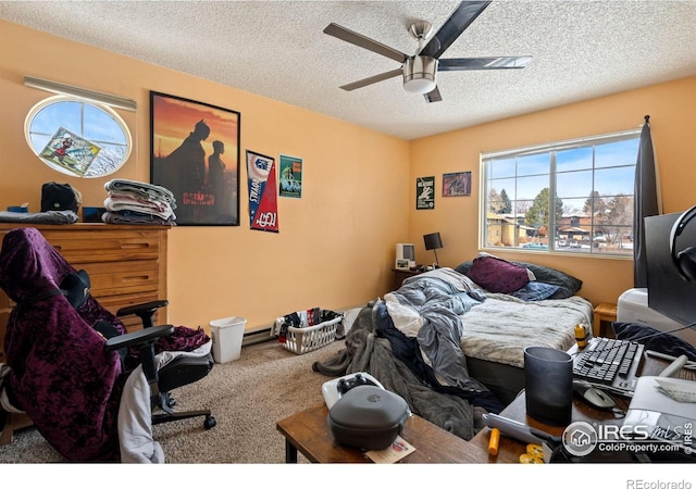 carpeted bedroom featuring ceiling fan and a textured ceiling