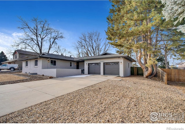 ranch-style home featuring a garage