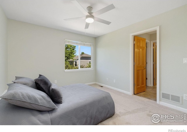 carpeted bedroom with ceiling fan