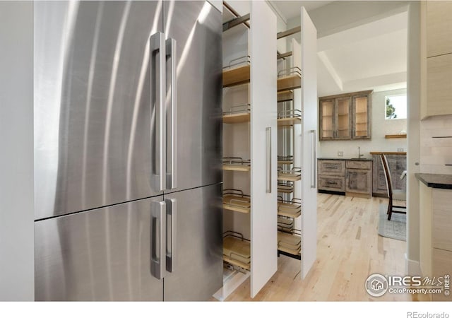 kitchen featuring stainless steel refrigerator and light wood-type flooring