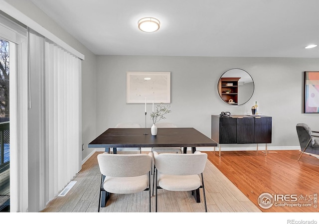 dining space featuring light hardwood / wood-style flooring