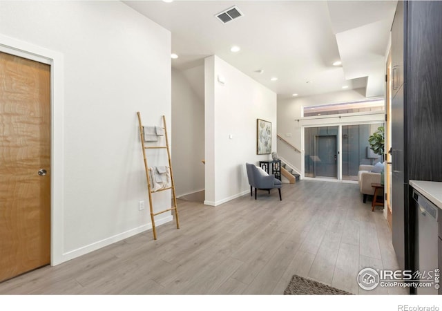 interior space with french doors and light wood-type flooring