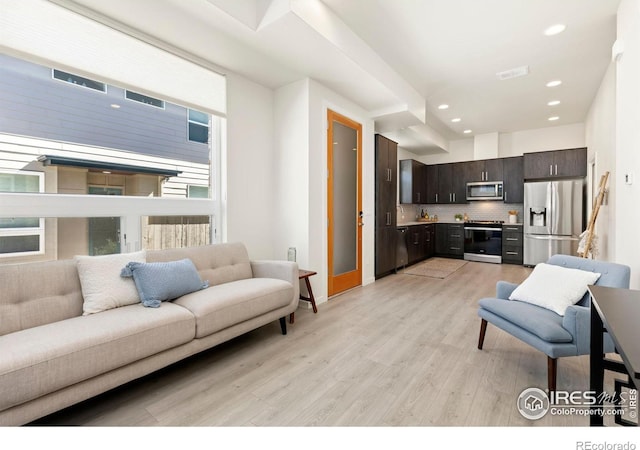 living room with light hardwood / wood-style flooring