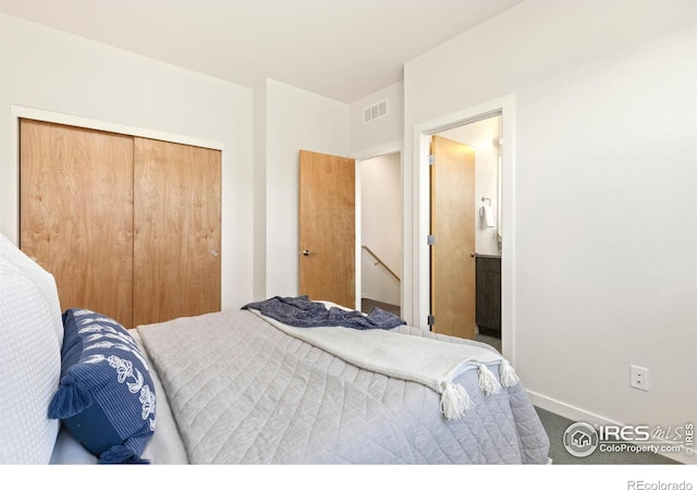 carpeted bedroom featuring a closet