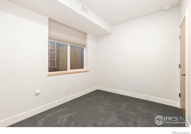 empty room with carpet flooring