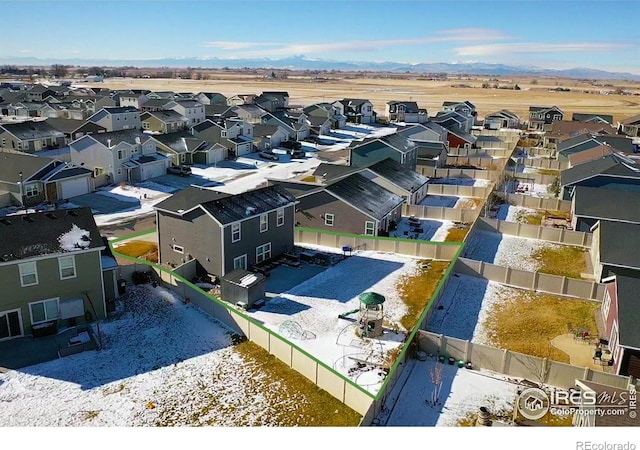 drone / aerial view with a residential view and a mountain view