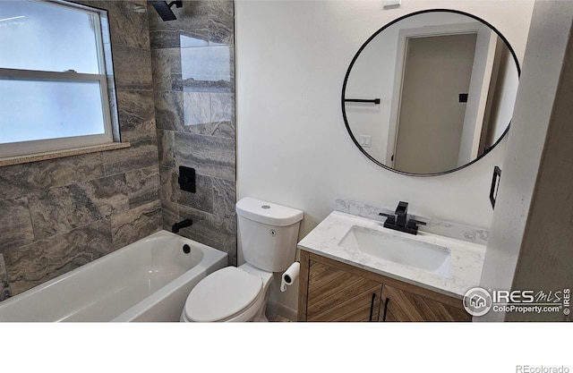 full bathroom with tiled shower / bath combo, vanity, and toilet