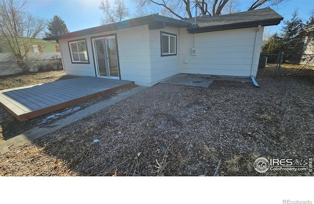 back of house featuring a deck