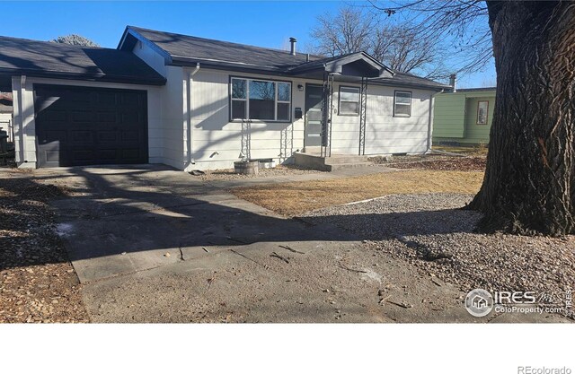 ranch-style house featuring a garage