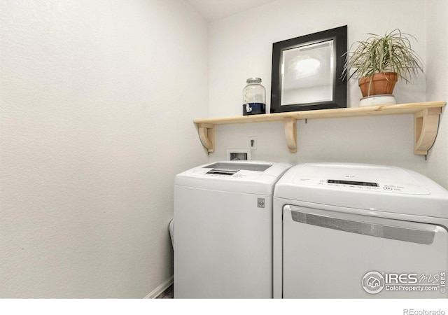 clothes washing area featuring washing machine and dryer