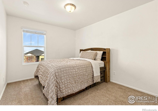 bedroom with light colored carpet