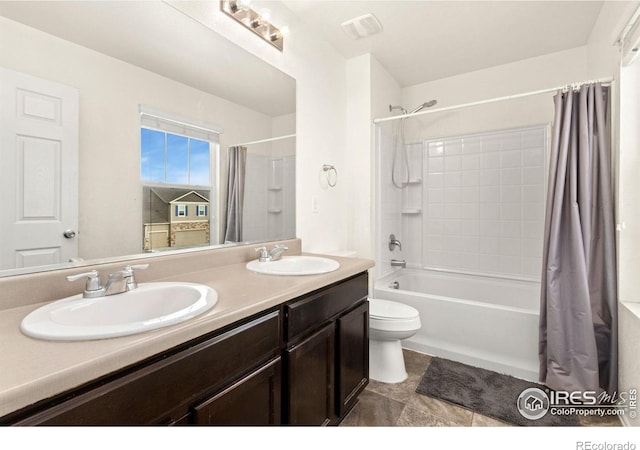 full bathroom with toilet, vanity, and shower / bath combo with shower curtain