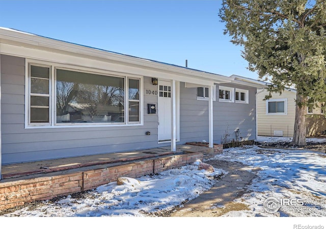 ranch-style home with covered porch