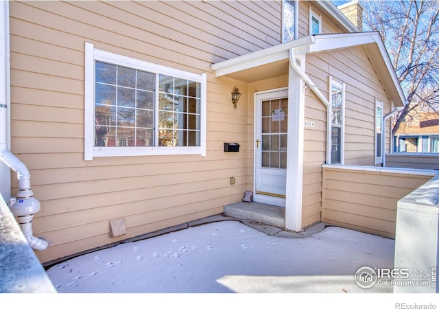 entrance to property with a patio area