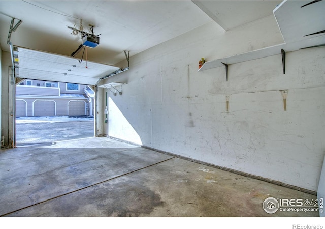 garage featuring a garage door opener