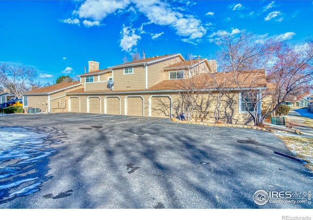 view of side of property with a garage