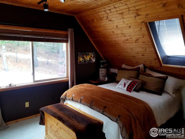 bedroom with wooden ceiling and lofted ceiling