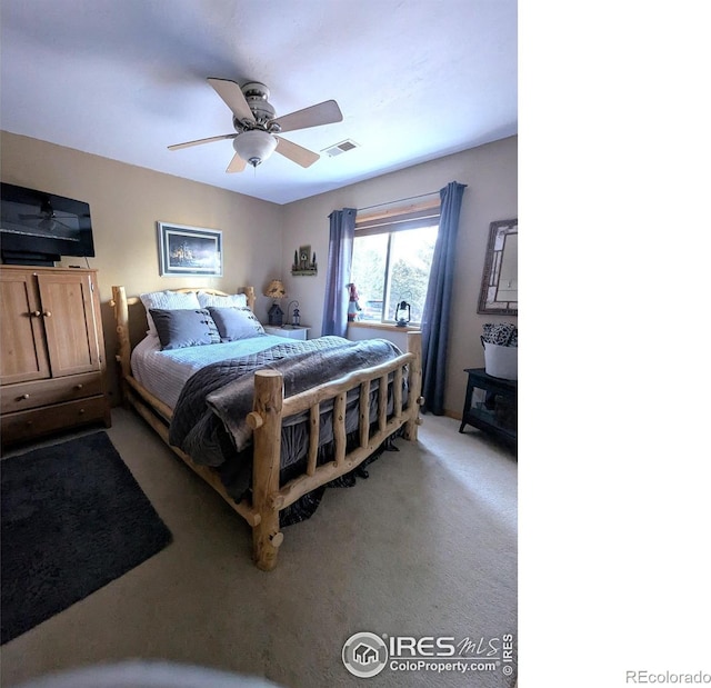 carpeted bedroom featuring ceiling fan