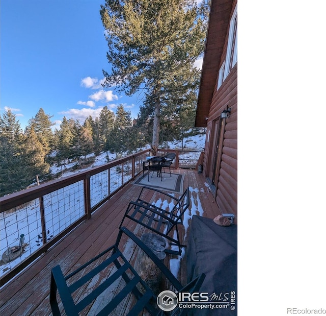 view of snow covered deck