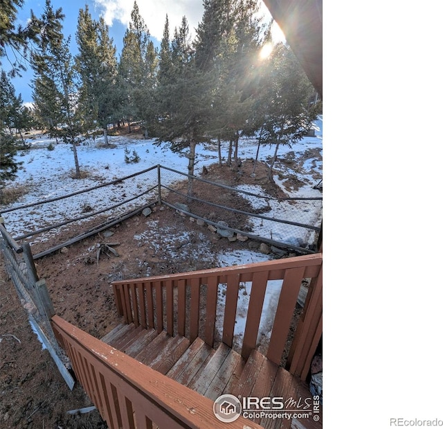 view of snow covered deck