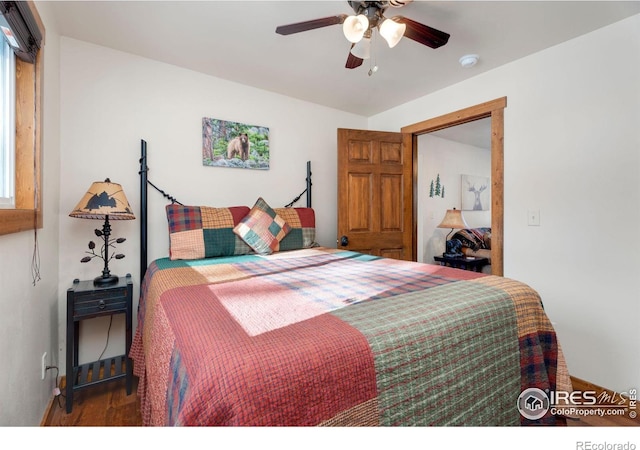 bedroom with ceiling fan and hardwood / wood-style flooring