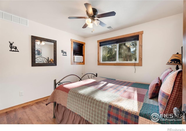 bedroom with light wood-type flooring and ceiling fan