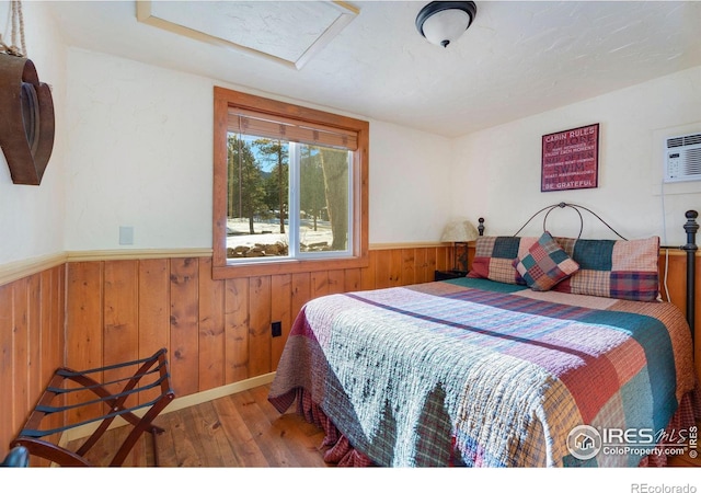 bedroom with hardwood / wood-style floors