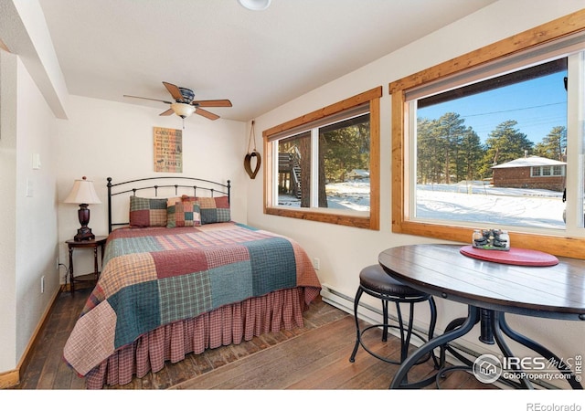 bedroom with ceiling fan and dark wood-type flooring