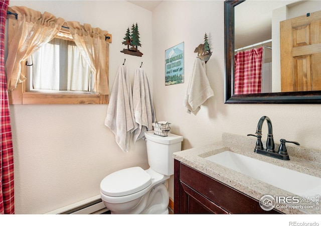 bathroom featuring vanity, a baseboard radiator, and toilet