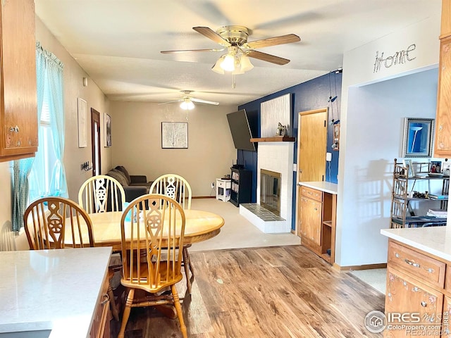 dining space featuring ceiling fan and light hardwood / wood-style floors