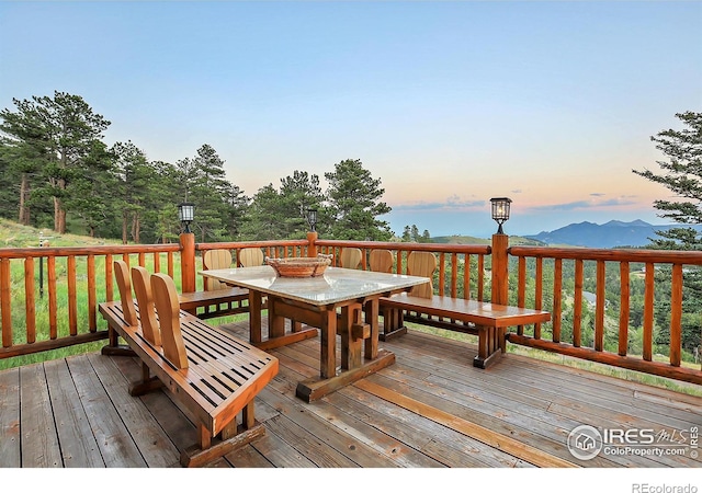 deck at dusk with a mountain view