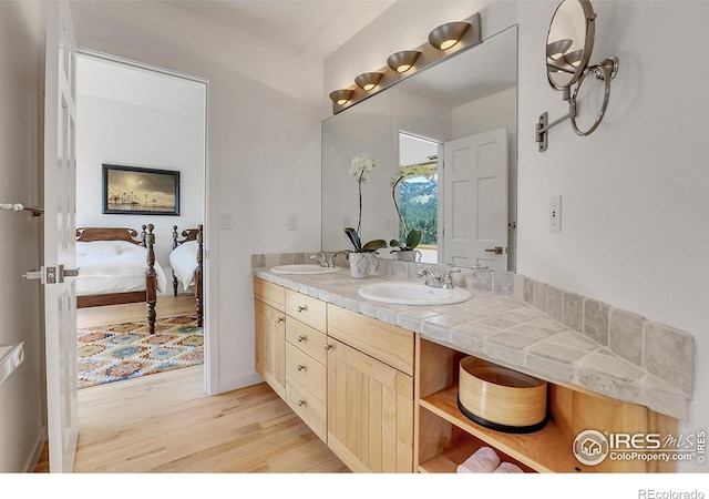 bathroom featuring hardwood / wood-style floors and vanity