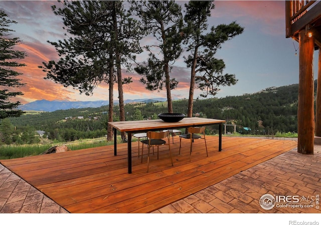 deck at dusk with a mountain view