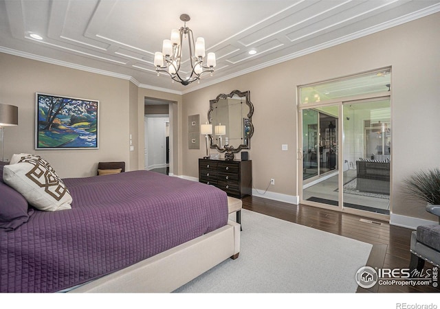 bedroom featuring dark hardwood / wood-style flooring, access to exterior, ornamental molding, and a chandelier