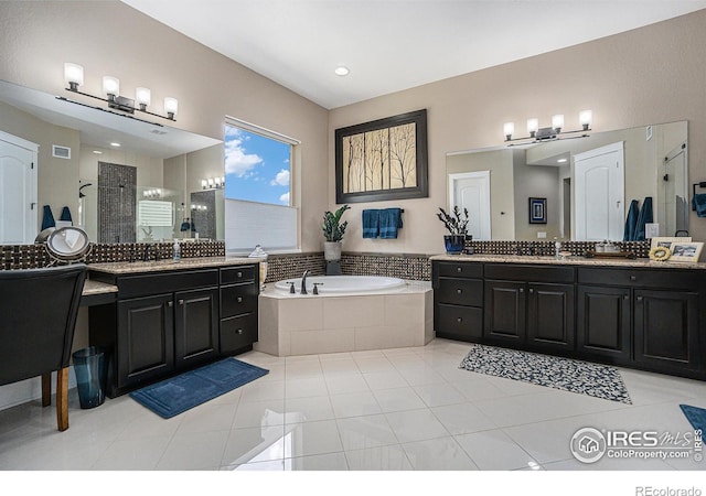 bathroom featuring vanity, tile patterned floors, and independent shower and bath